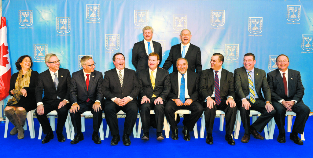 Canadian and Israeli ministers and diplomats pose during Stephen Harper’s 2014 visit