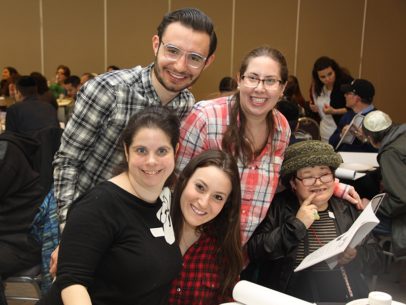 Seen at the third seder for JEM Workshop employees are, back row, YAD volunteers Cedric Skulnik and Aryelle Segal, and, in front from left, JEM employee Marni Spunt, YAD volunteer Eliana Ferdman and JEM employee Miriam Dergel